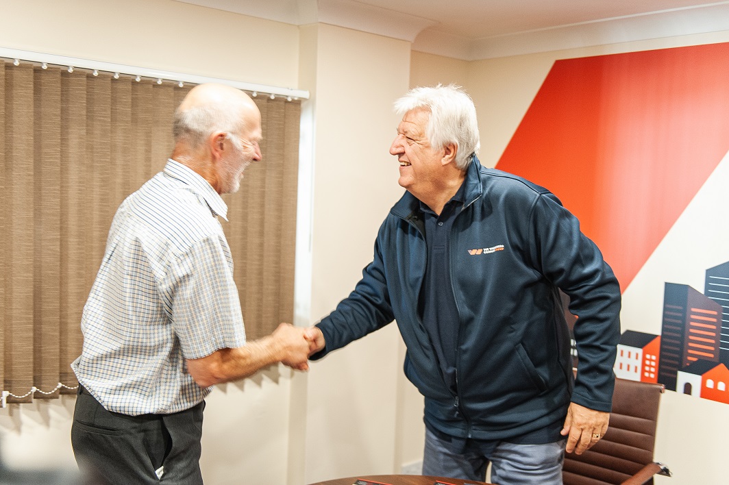 Barry at TWC shaking hands with a client