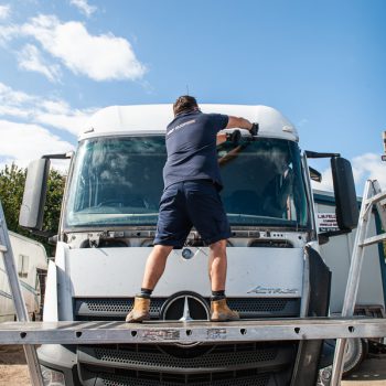 windscreen technician working on a lorry