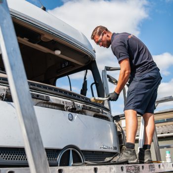 technician working on truck windscreen
