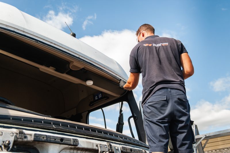 The Windscreen Company Technician replacing a HTV truck
