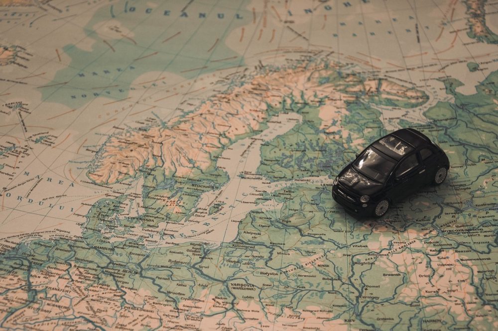 map wioth a toy car placed on top